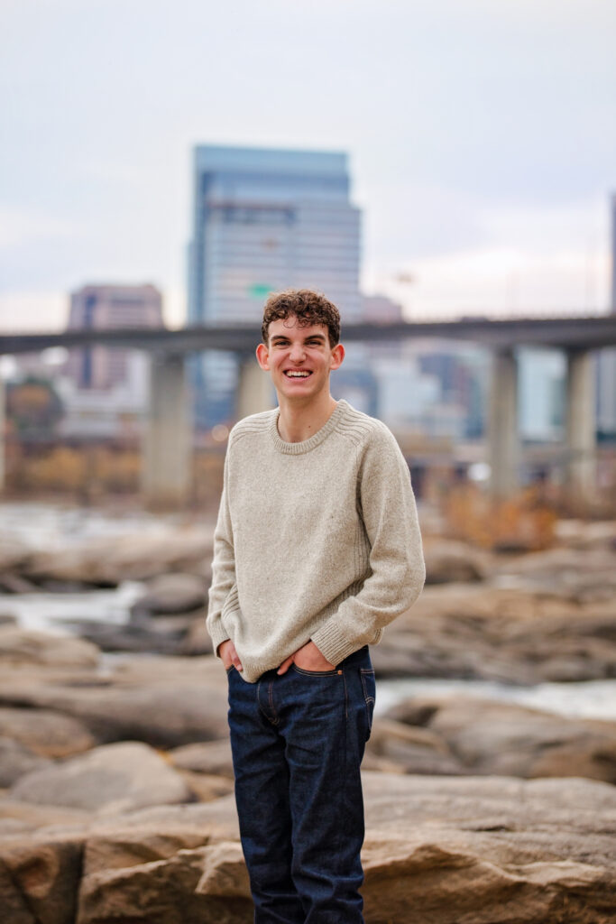 Candid smile of a young main on the belle isle rocks in downtown Richmond, Virginia