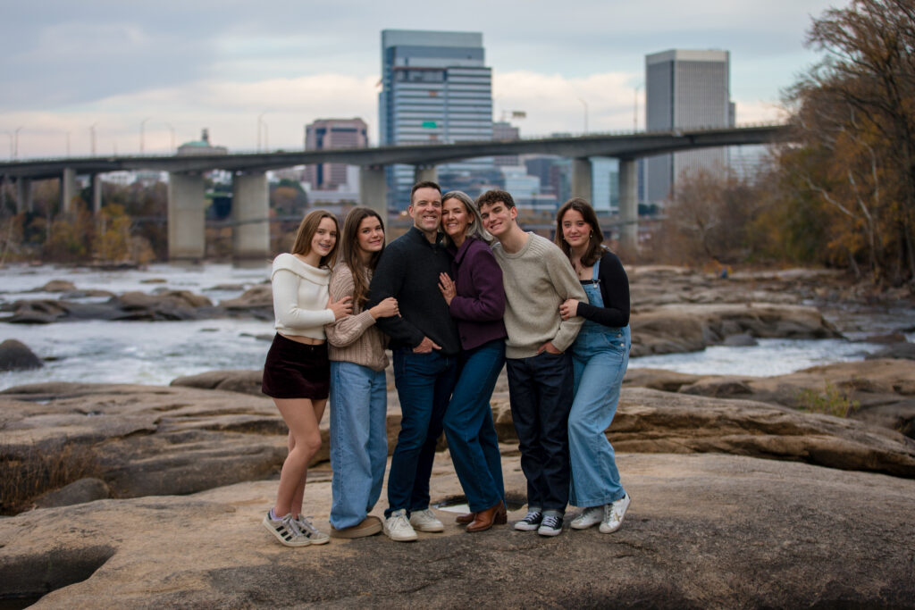 Family portrait taken on the rocks at Belle Isle by Kat Jones Creative
