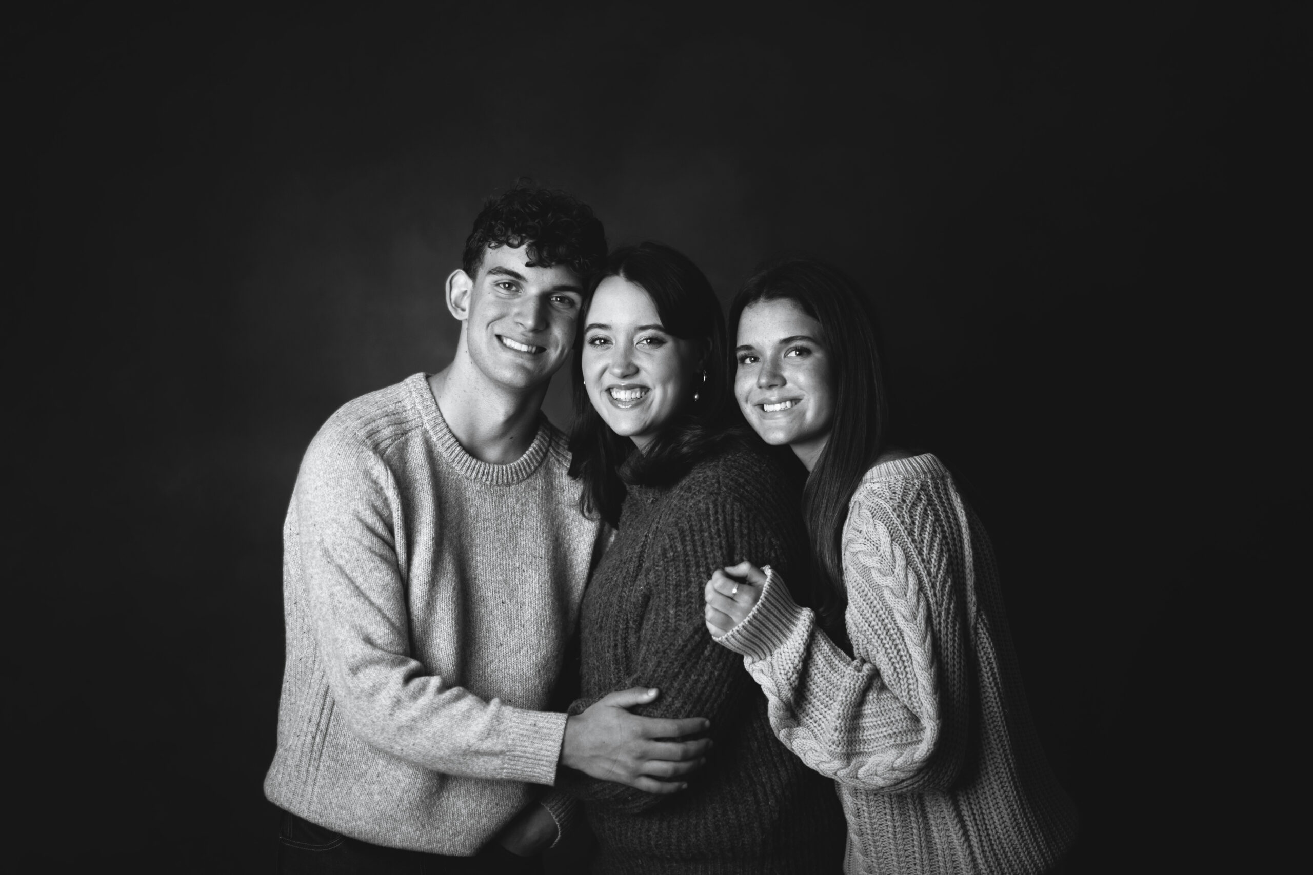 In studio portrait of senior triplets by Kat Jones Creative