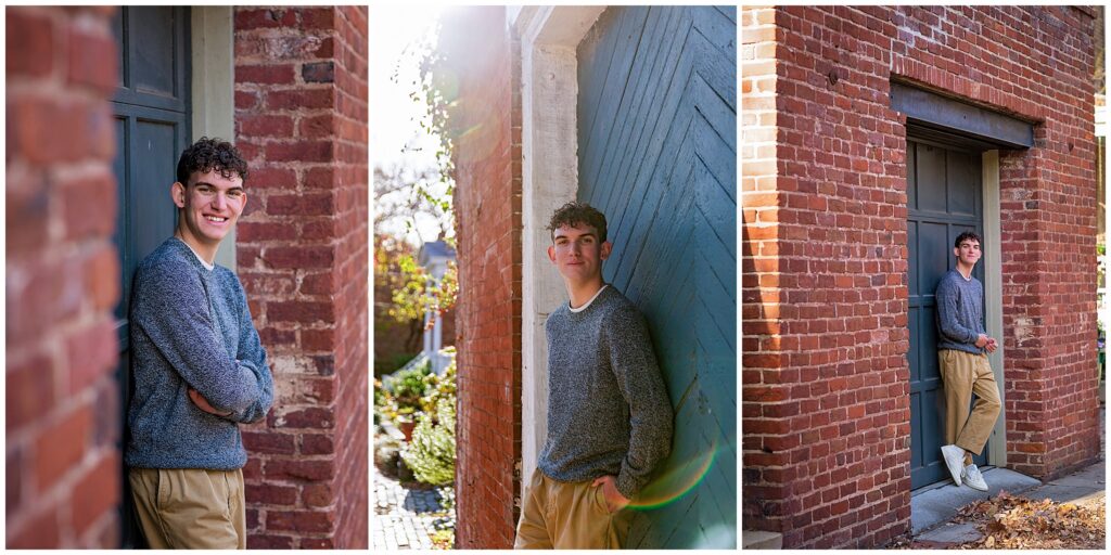 High School Senior boy smiles and leans against Libby Hill neighborhood garage door