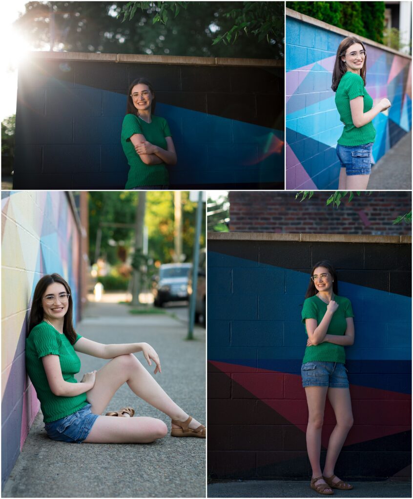 High School senior girl in emerald green smiles in front of colorful, geometric mural in Carytown.